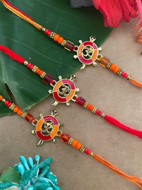 Shop (Set of 3) Tortoise OM Rakhi Bracelet Online – Digital Dress Room