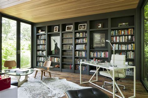 Built-in floor-to-ceiling bookshelves filled with Carnahan’s favorite ...
