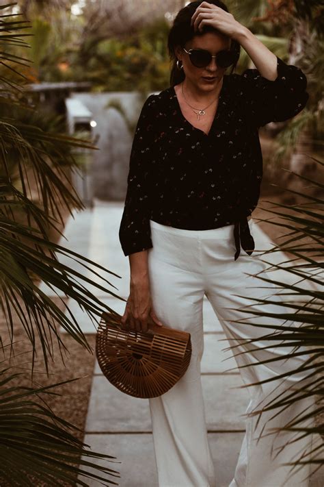 Vacation Style: Wrap Top + White Pants | Tropical vacation outfits ...