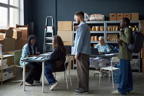 Collaborating in modern warehouse office environment | Premium Photo