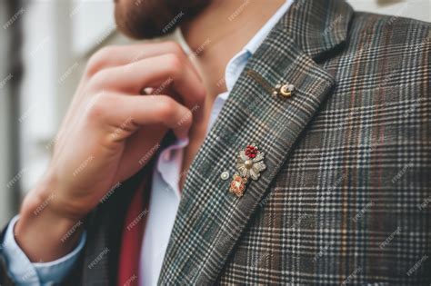 Premium Photo | Man showing off a bohostyle lapel pin on a blazer