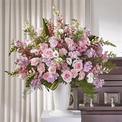 Floor baskets & pedestal arrangements by The Flower Factory