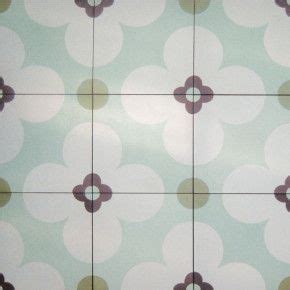 a tiled floor with brown and white circles on it's surface, in an area ...