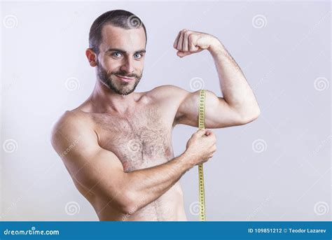 Athletic Man Measuring His Biceps Size Stock Photo - Image of flexed ...