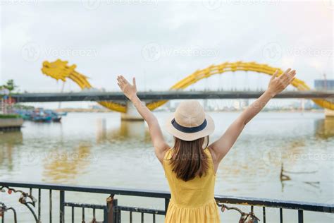 Woman Traveler with yellow dress visiting in Da Nang. Tourist ...