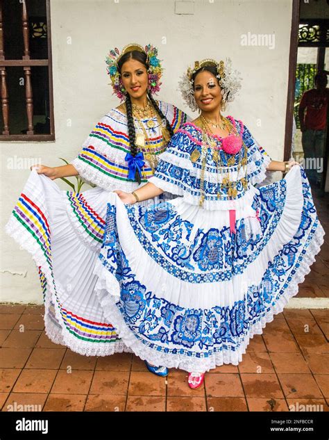 Two Panamanian women wearing the colorful traditional pollera, the ...