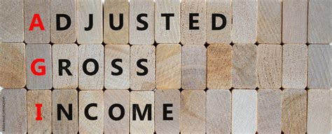 AGI adjusted gross income symbol. Concept words AGI adjusted gross ...