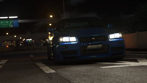 Download Nissan Skyline Gtr R34 At Highway Wallpaper | Wallpapers.com