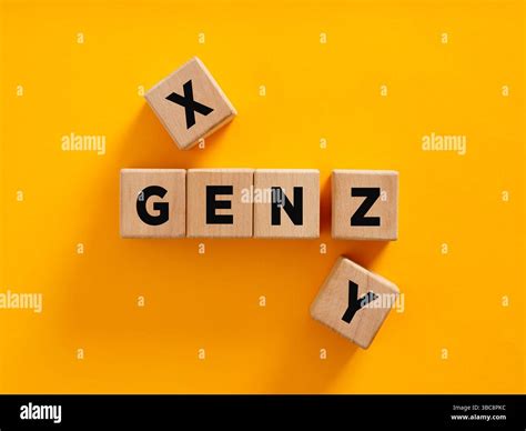 Wooden cubes composing the acronym gen z with other two cubes, representing the generation x and ...
