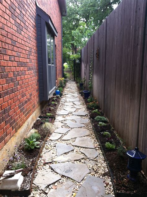 Just planted: A straight and narrow walkway down a sunny south-facing ...