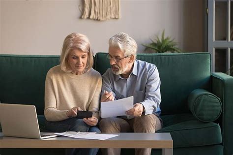 https://www.athomeindependentliving.com/wp-content/uploads/2020/04/senior-couple-reviewing-finances.jpg?utm_source=chatgpt.com