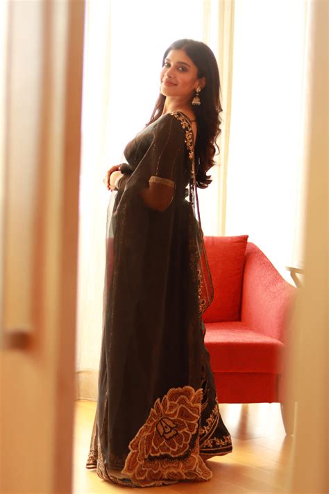 Actress Dushara Vijayan in a black organza saree by Archana Karthick