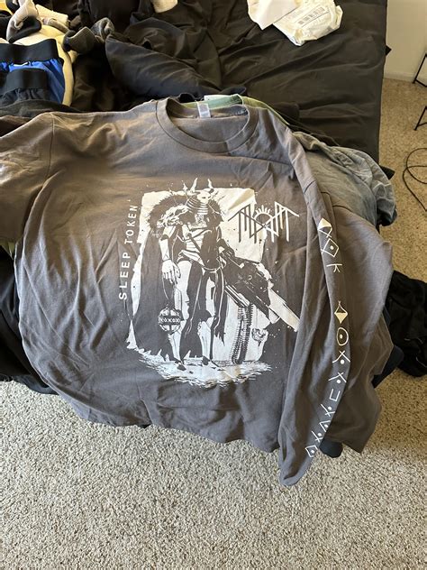 Merch day has arrived! But what does the sleeve say? : r/SleepToken