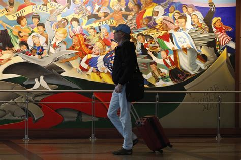 The true story behind the conspiracy-ridden murals at Denver ...