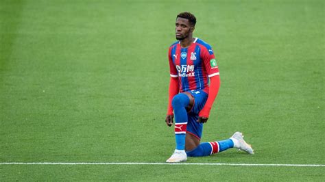 Palace's Zaha: Kneeling before games is 'degrading,' 'box-ticking' - ESPN