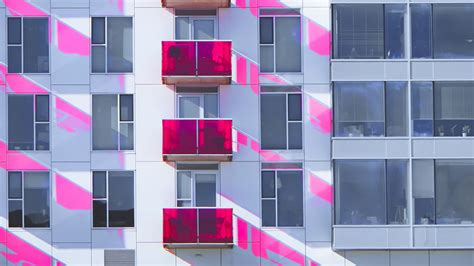 Download wallpaper 2048x1152 building, facade, windows, balconies ...
