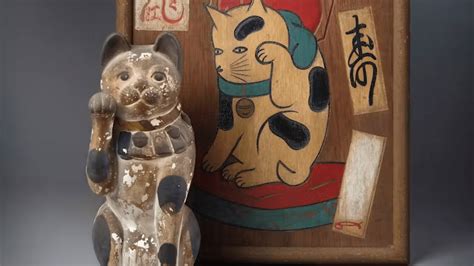 What is the story of maneki-neko, the Japanese beckoning cat?