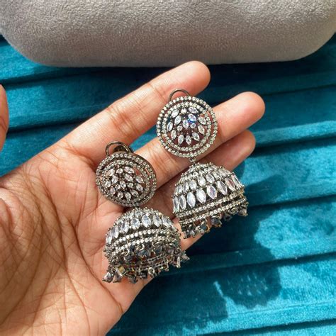 Round zircon revolving jhumkas – Alluring Accessories