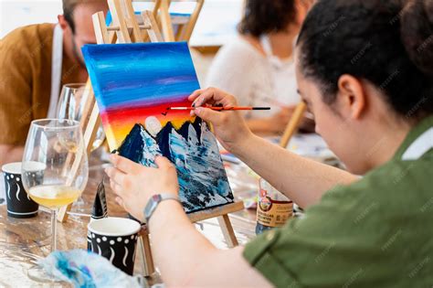 Premium Photo | Artistic cheers wine and painting with happy friends