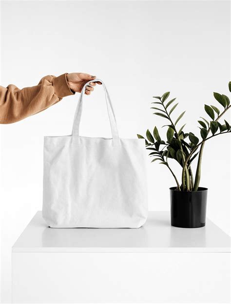 Free Women Holding Big Canvas Bag Mockup PSD - PsFiles