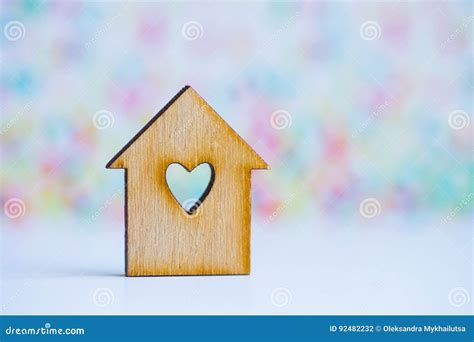 Wooden House with Hole in Form of Heart on Colorful Background Stock ...