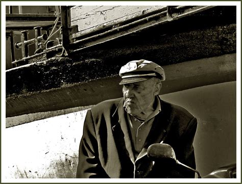 This picture is of Dan Cody next to a boat . Therefore showing that he ...