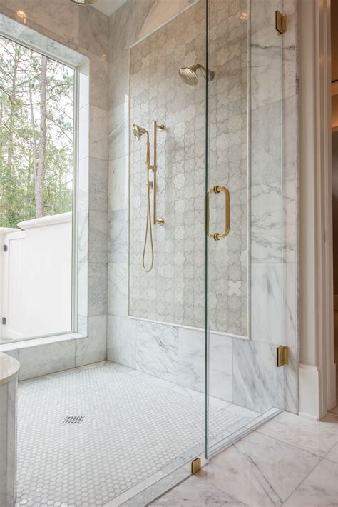 Luxurious Master Bathroom with Timeless Marble and Gold Accents