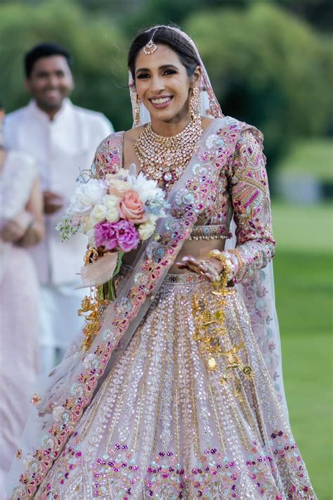 Gunjan Amarnani In Pink Tulle Self And Multicoloured Embroidered Lehen ...