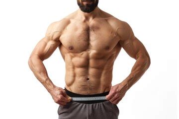 Muscular man displaying abs and measuring waistline on white background ...