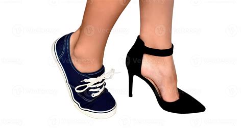 Two different types of shoes high heels and sneakers on womens feet ...