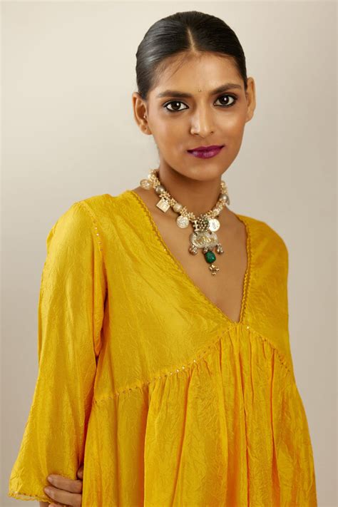 Deep yellow silk hand crushed V neck gathered kurta set, highlighted w ...