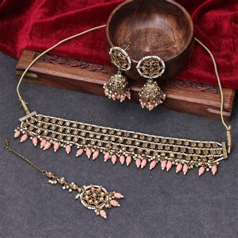 Sukkhi Amazing Gold Plated Reverse AD & Pearl Peach Necklace Set for W ...