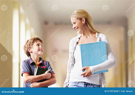 Teacher Talking To Student In Hallway