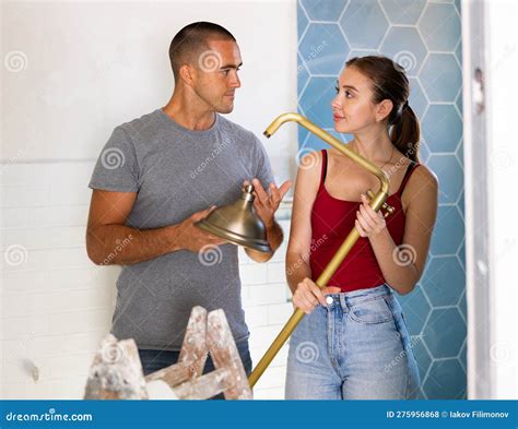 Husband and Wife Installing a New Shower in Bathroom Together Stock ...