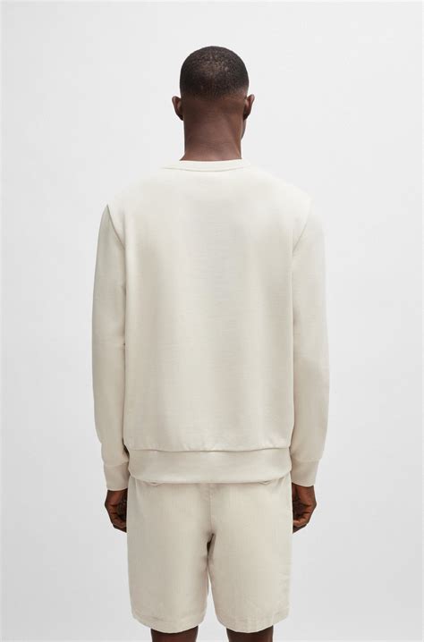 BOSS - Cotton-terry relaxed-fit sweatshirt with seasonal artwork