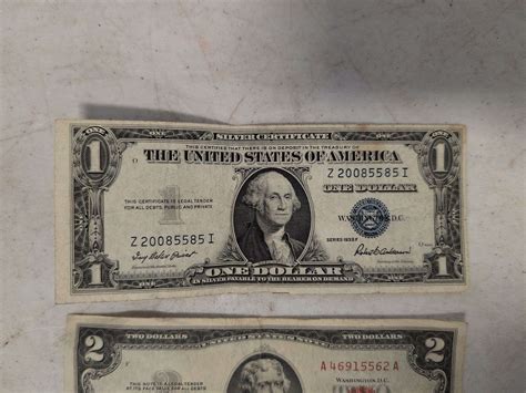 1935 silver dollar bill and (2) 2-dollar bills - Kaufman Realty & Auctions