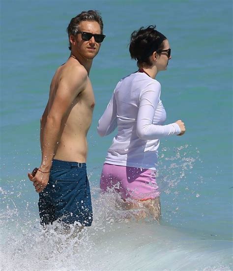 Anne Hathaway in a Covered Bikini, Beach in Miami - March 2014 • CelebMafia