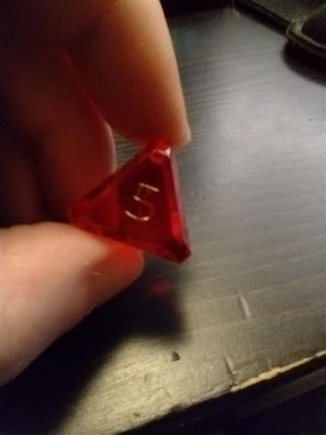 I've had this weird 5-sided die for over a decade. Any idea where it is ...