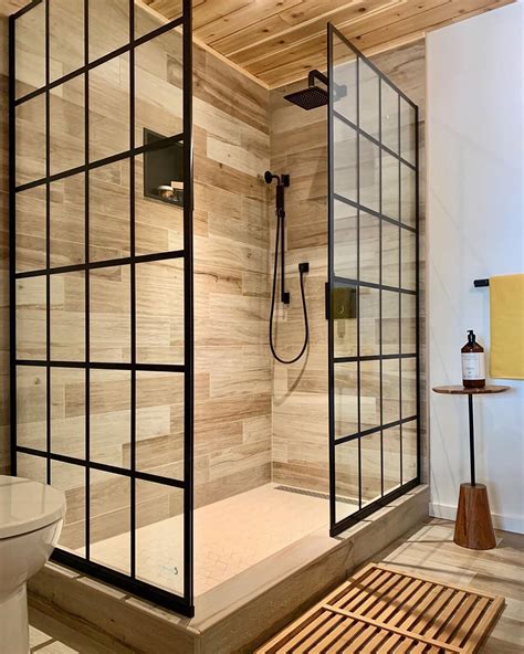DreamLine grid pattern glass shower doors in a modern rustic cabin ...
