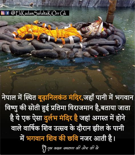 an elephant laying on top of a pile of rocks in water with the caption