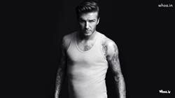 David Beckham With Adidas Football With Dark Background Wallpaper