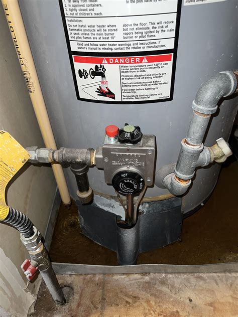 Is the water heater leaking? Or is it supposed to drip? : r/howto