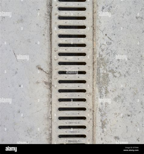 Drain grate in concrete floor Stock Photo - Alamy