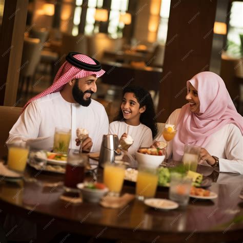 Saudi Arab family man eating restaurant dinner table enjoying meal ...