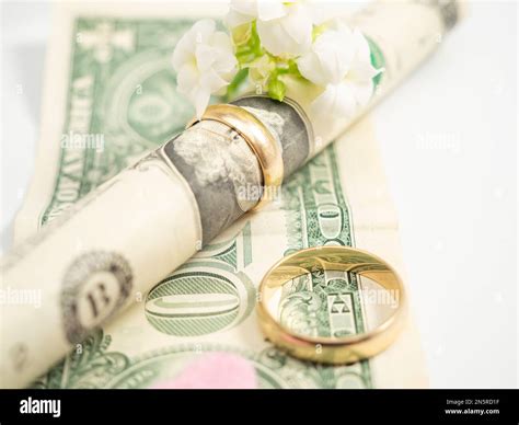 Wedding rings and dollars. The concept of marriage of convenience ...