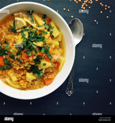 Red lentil stew with potato, carrot and turmeric. Toned photo. Healthy ...