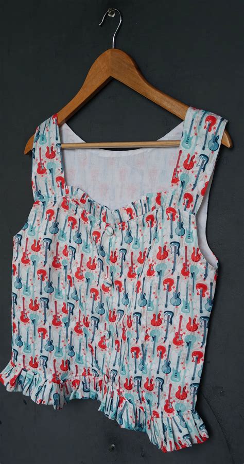 Quirky guitar printed top - frills at neck and hem – Handpicked