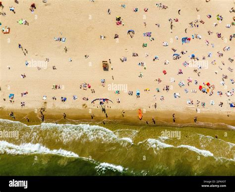 People at the beach during hot summer day Stock Photo - Alamy