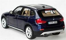 bmw x1 1 43 bmw x1 e84 deepseablue met werbemodell schuco bmw x1 1 43 bmw x1 e84 deepseablue met werbemodell schuco