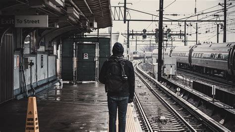 Download wallpaper 1920x1080 man, railway, station, platform, rails ...